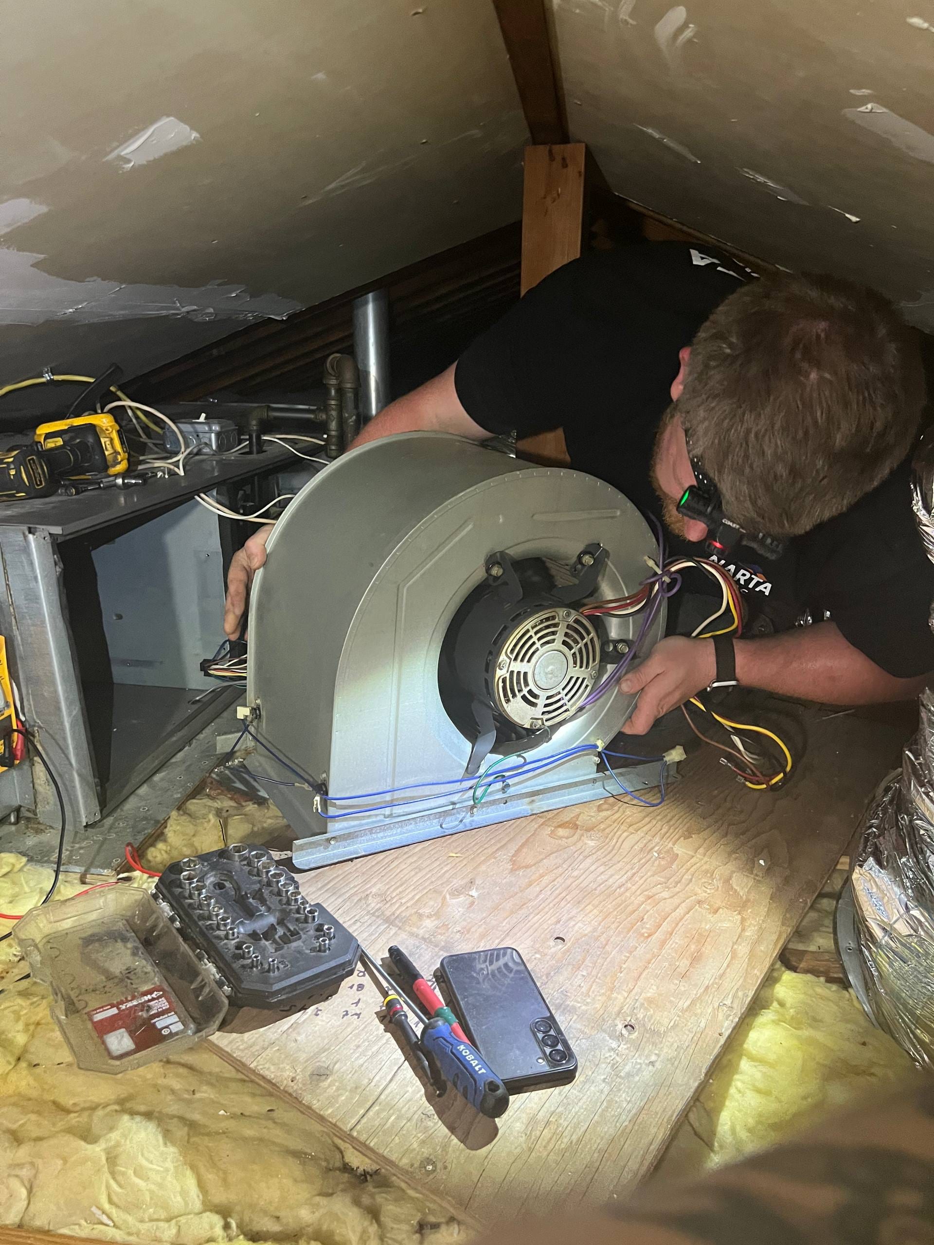 Central AC air handler restored after replacing the blower motor and capacitor. Following a diagnostic service call, the system was repaired and returned to operation the same day.
